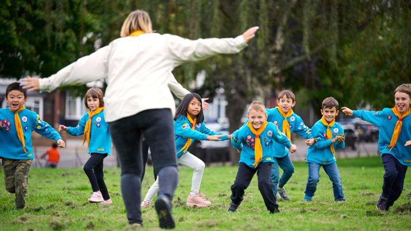 Children dressed in Beavers uniforms playing